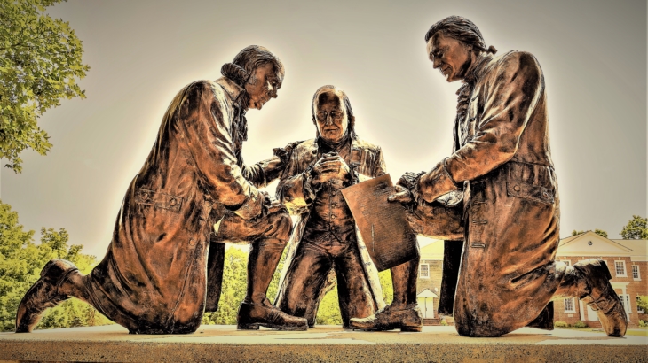 Founding Fathers John Adams, Benjamin Franklin, Thomas Jefferson kneeling in prayer at Valley Forge, PA, bronze sculpture by Stan Watts at Freedoms Foundation of Valley Forge