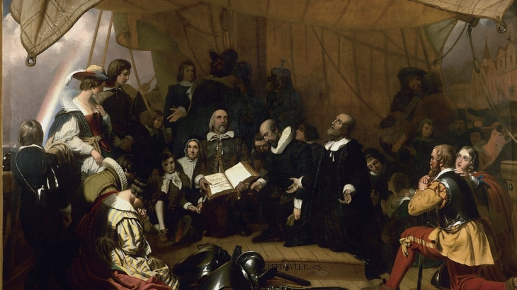 “Embarkation of the Pilgrims” by Robert W. Weir, 1844, United States Capitol Rotunda. John Carver, William Bradford, Miles Standish kneeling in prayer during their voyage to North America; open Bible, symbols within the painting of God’s promises.