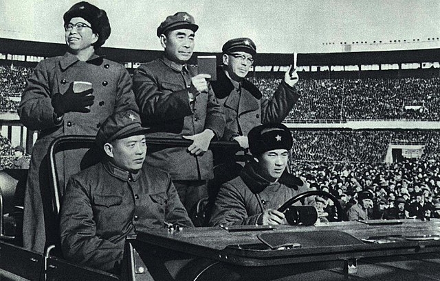 Jiang Qing (left) was wife of Mao Zedong, received the Red Guards in Beijing w/Premier Zhou Enlai (center) & Kang Sheng. All holding the Little Red Book (Quotations from Mao).